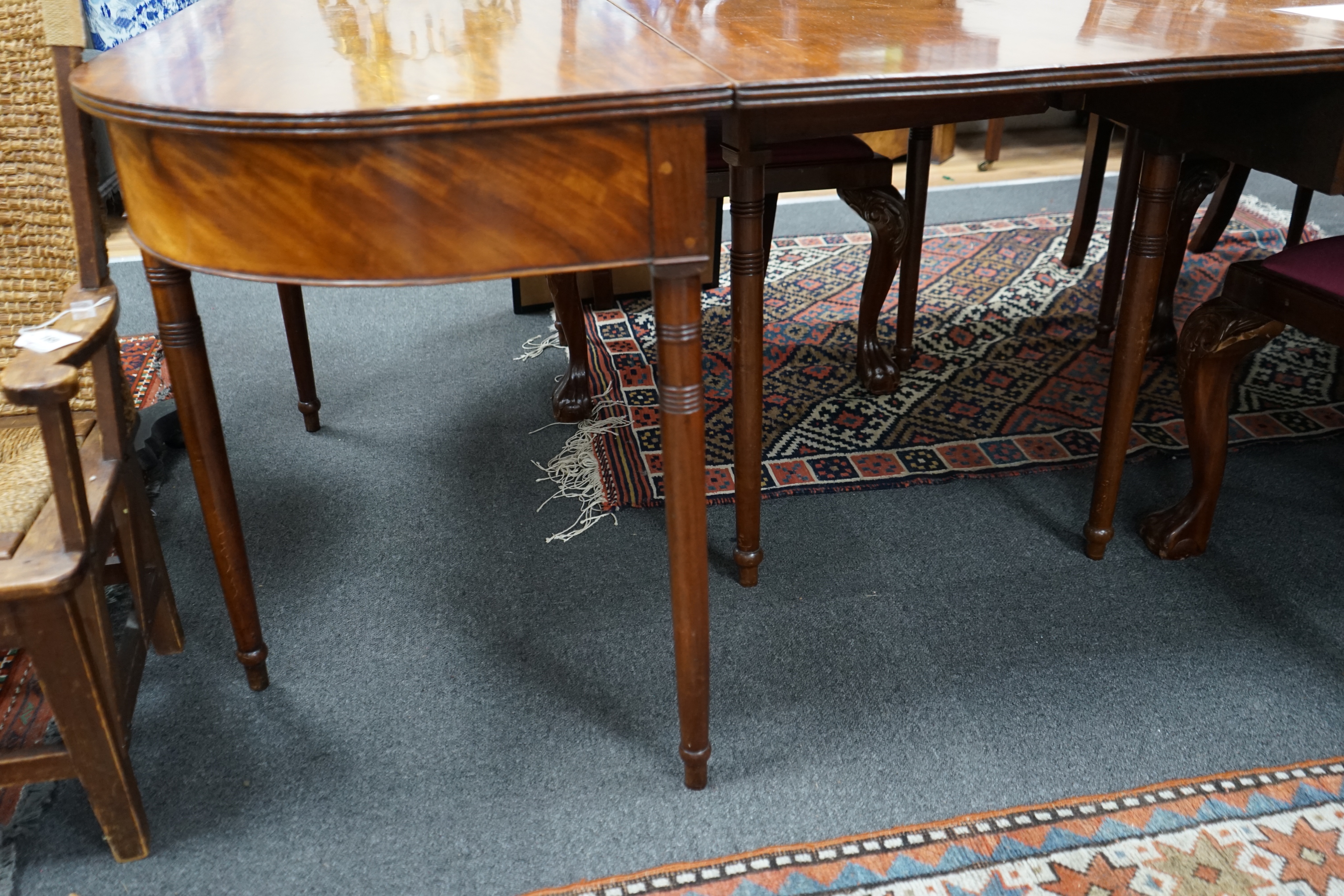 A George III mahogany D end extending dining table and six reproduction Chippendale style mahogany dining chairs, table 275cm extended, width 137cm height 74cm